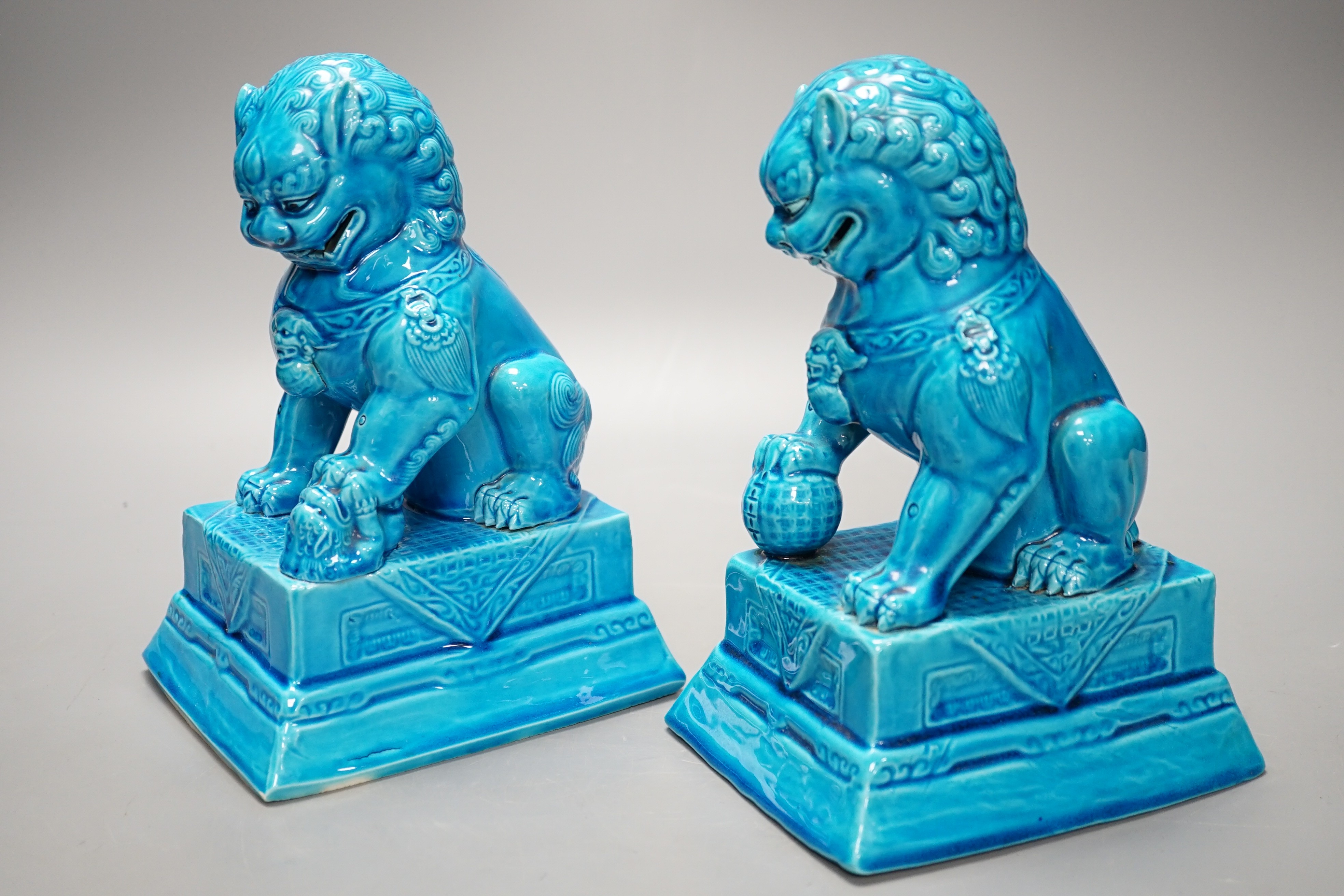 A pair of Chinese turquoise glazed temple lions 21cm